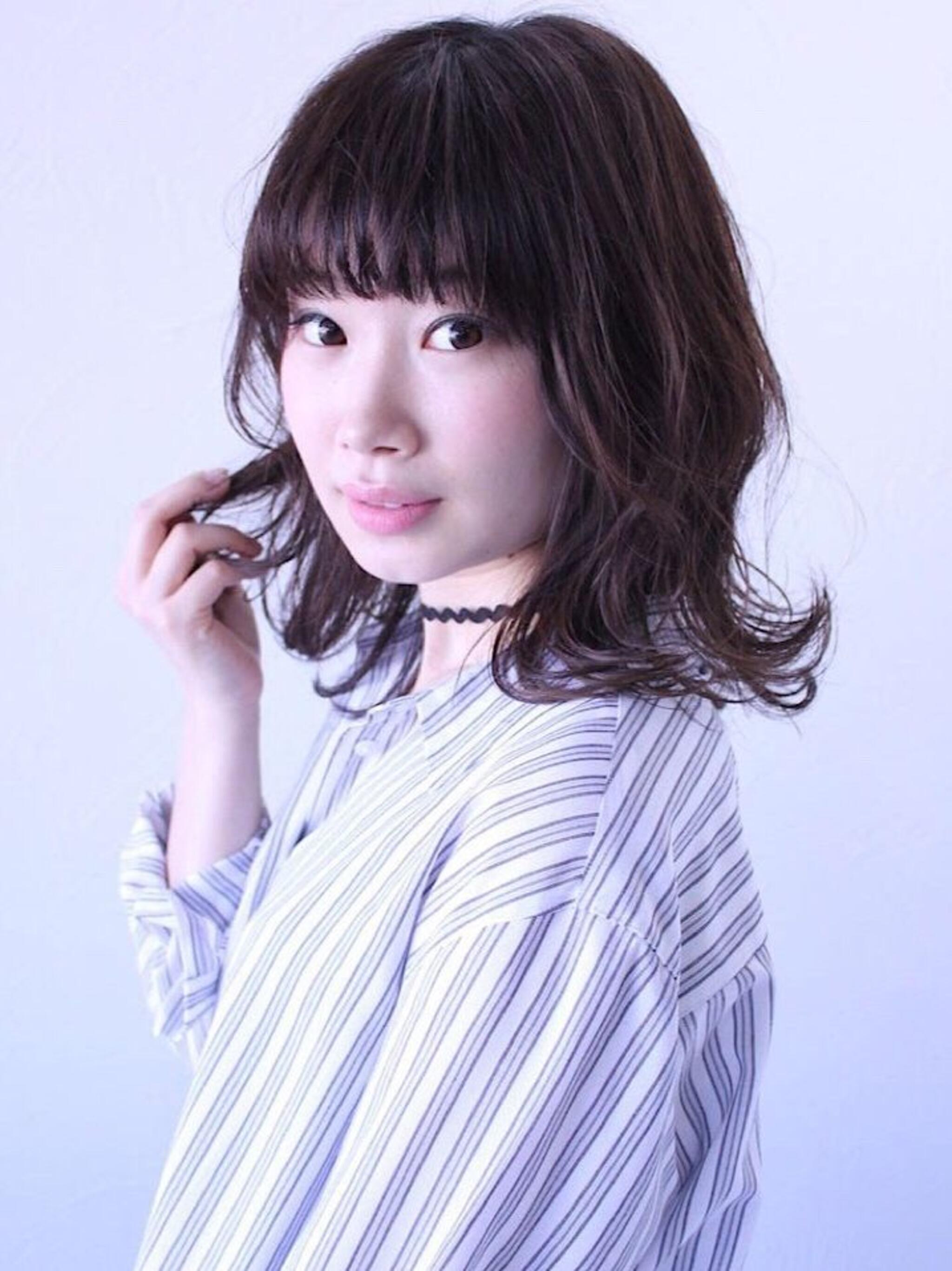 動きのある外ハネミディアムスタイル